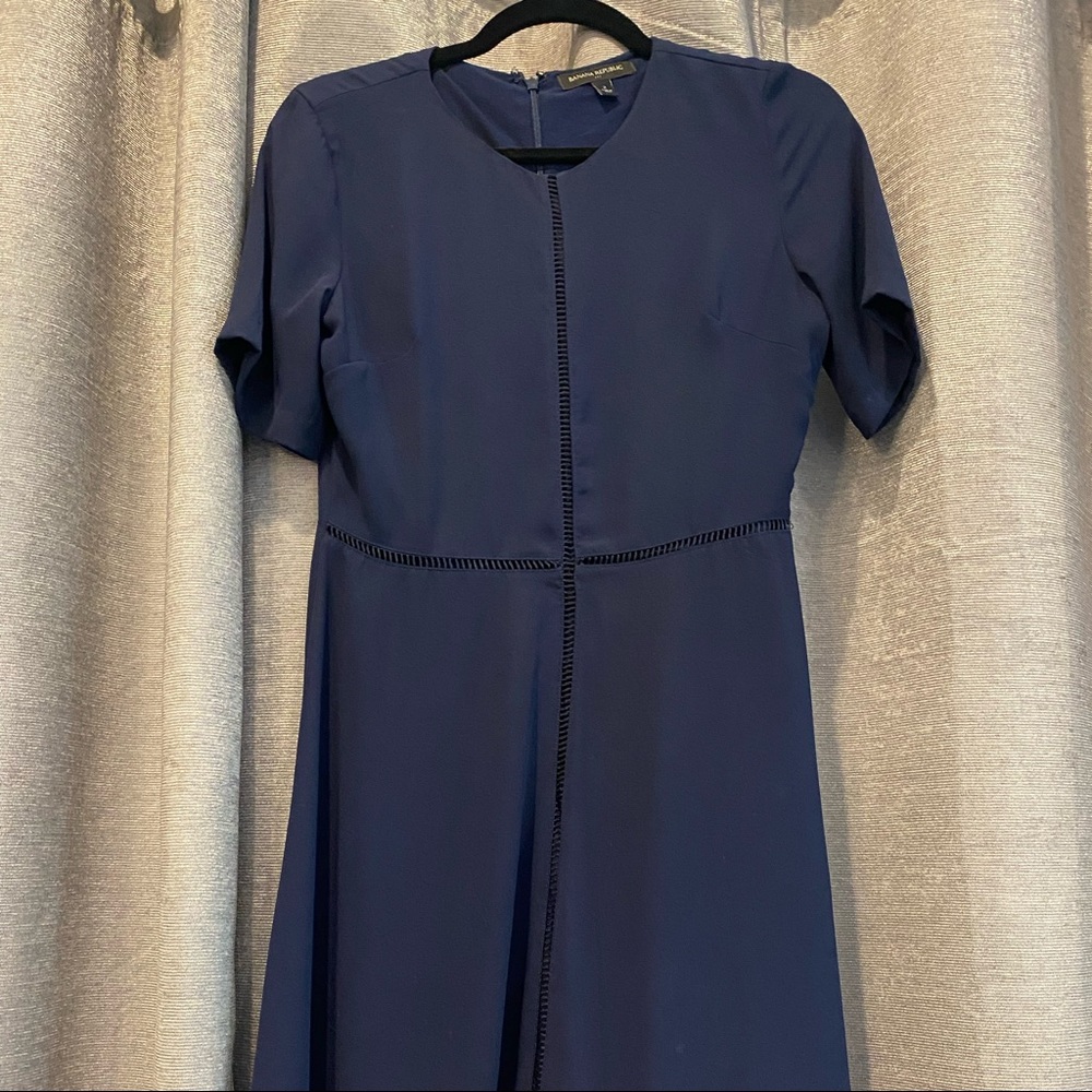 Navy empire waist dress hits right below my knee 5’2. Soft material with lining